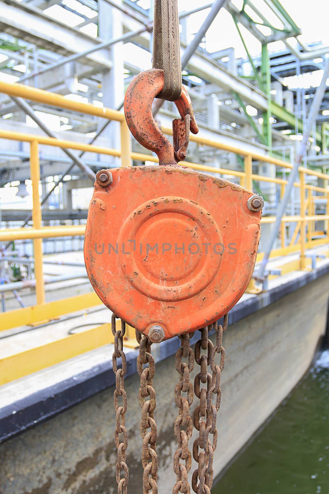 Industrial hook hanging on reel chain