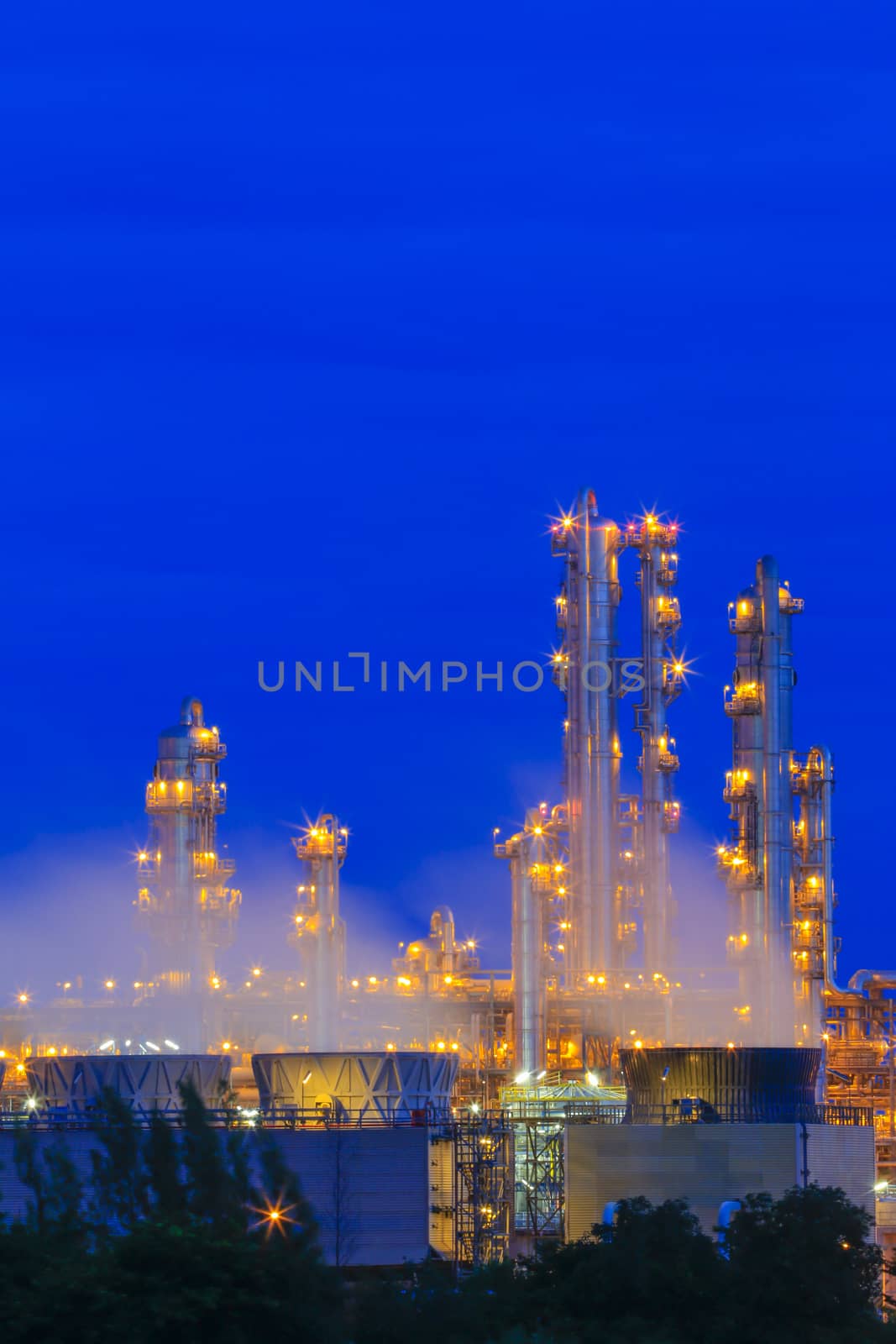 Lighting on structure of oil and chemical refinery plant on twilight time