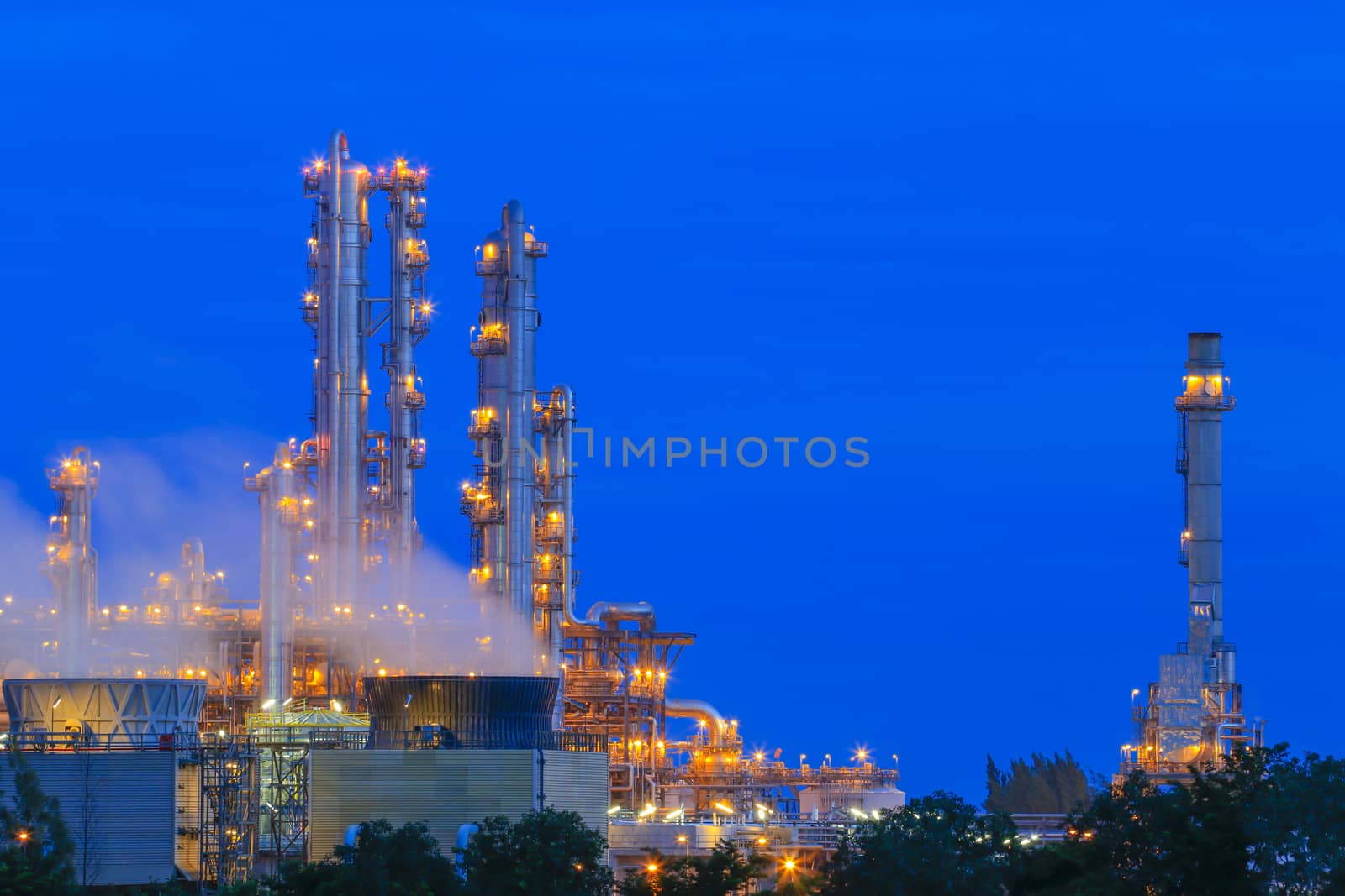 Lighting on structure of oil and chemical refinery plant on twilight time