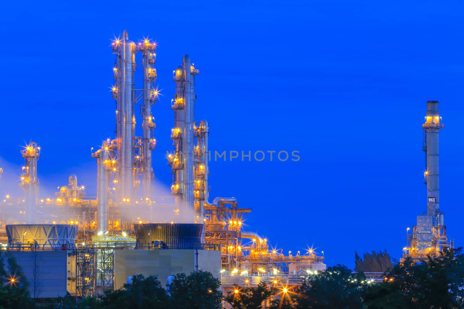 Lighting on structure of oil and chemical refinery plant on twilight time