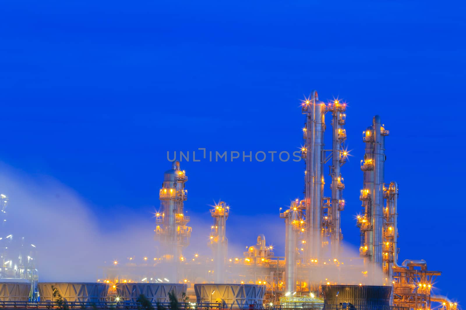 Lighting on structure of oil and chemical refinery plant on twilight time