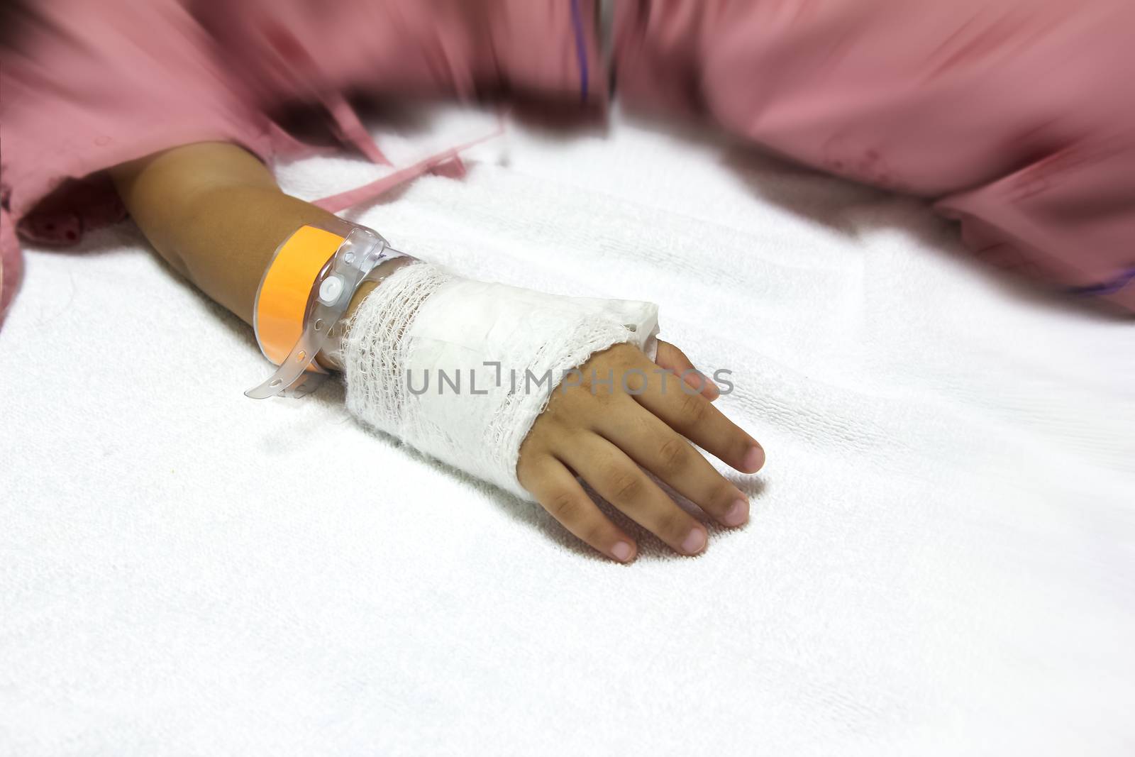 hand of sick Little girl in hospital bed