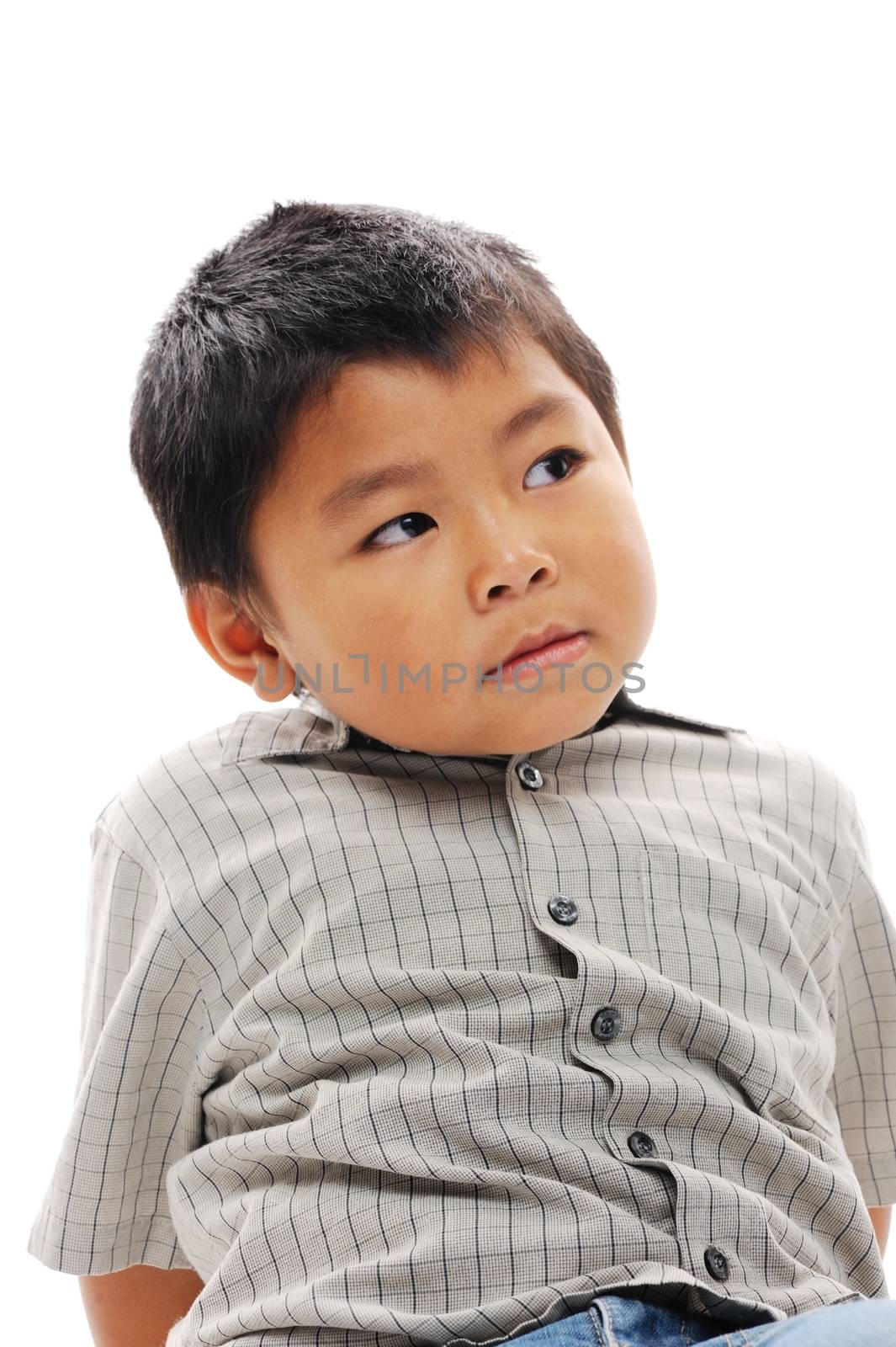 Asian boy looking serious and contemplating