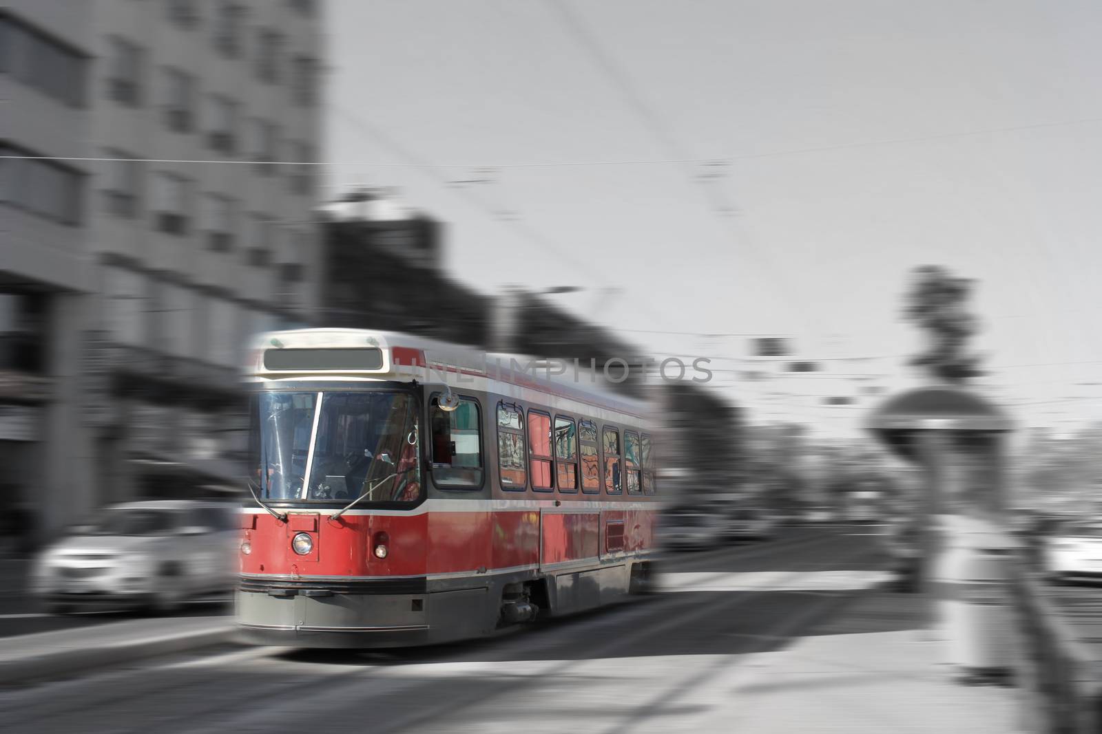 Streetcar transportation in downtown Toronto, Canada with motion blur in black and white and color