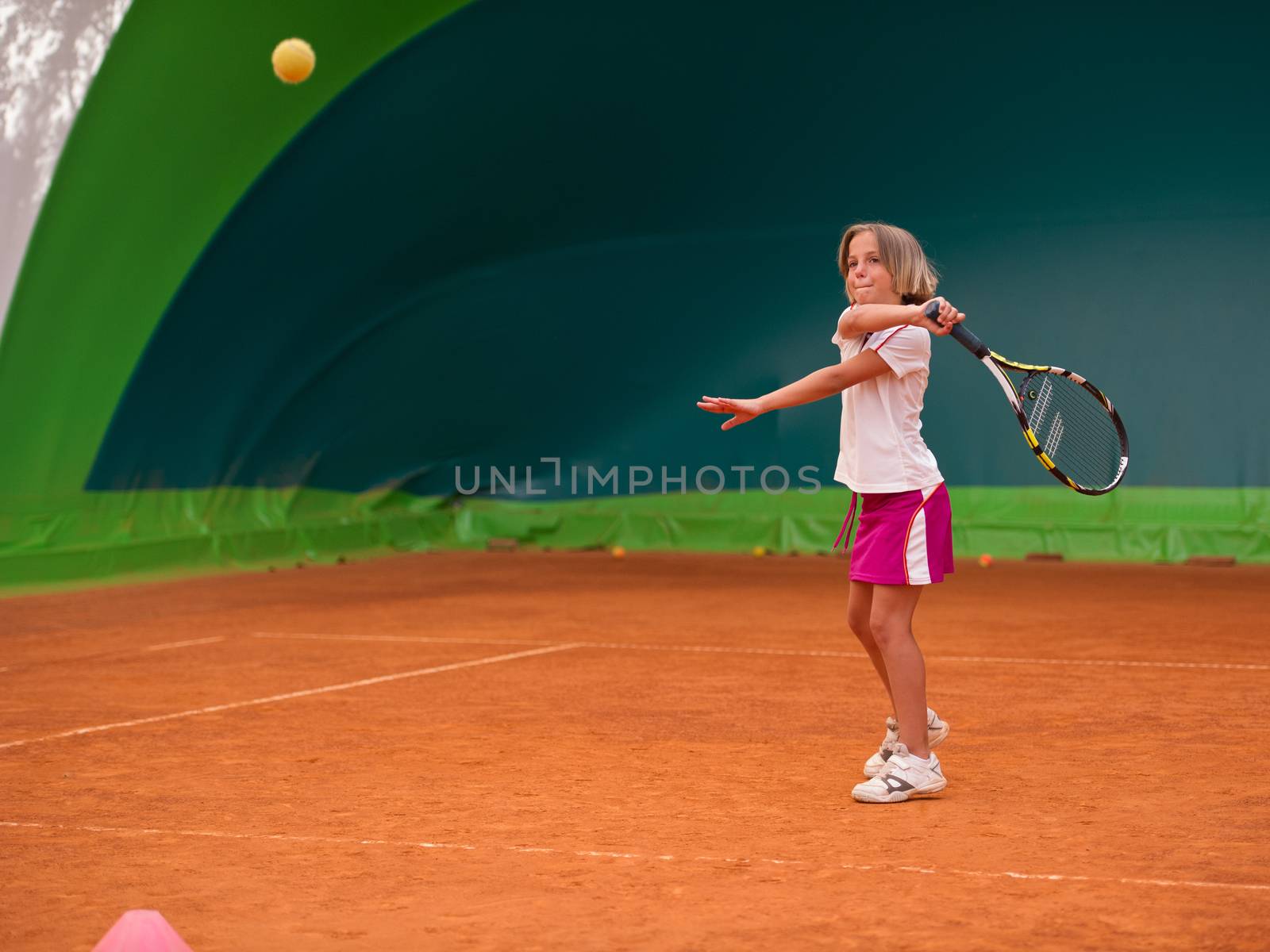 Children at school during a dribble of tennis