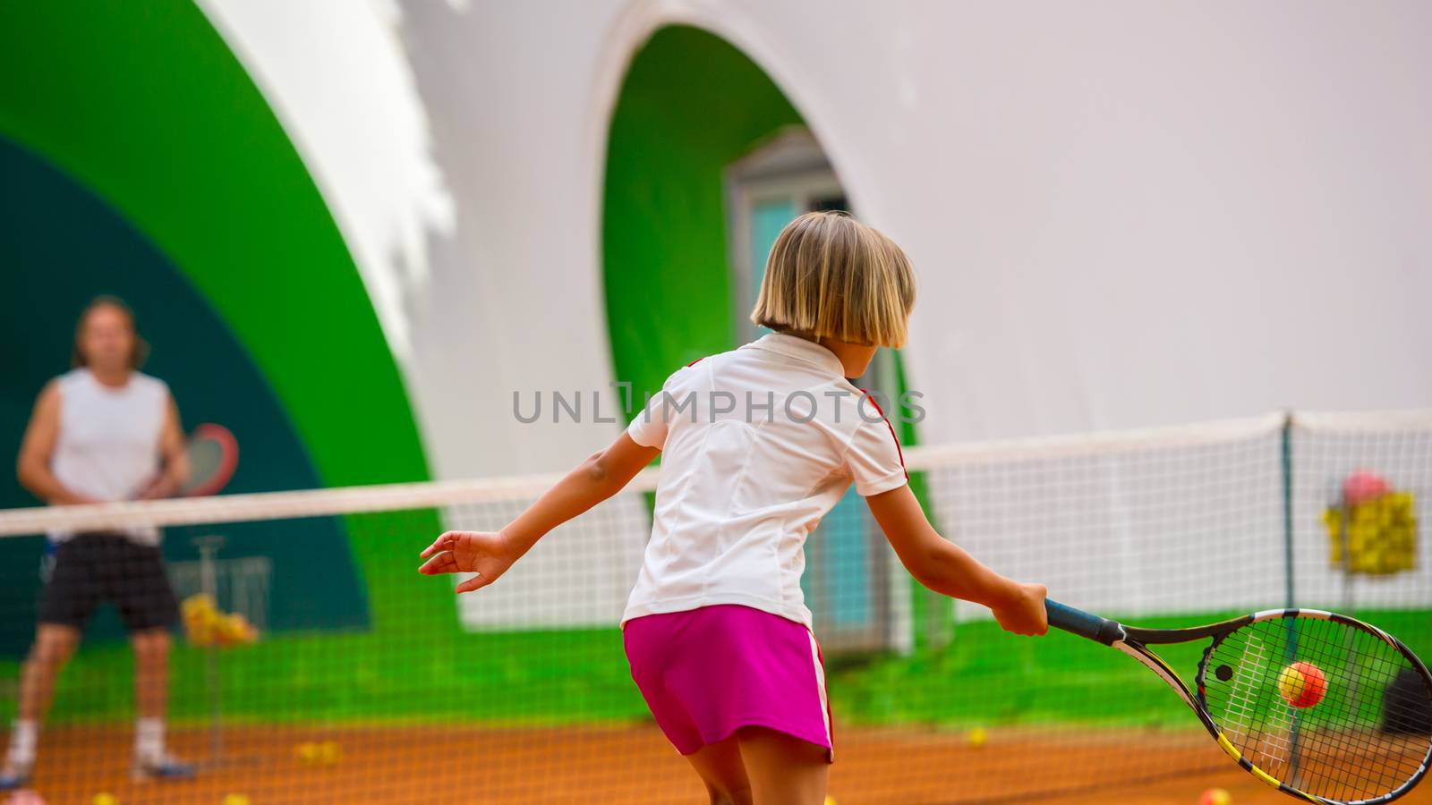 Children at school during a dribble of tennis