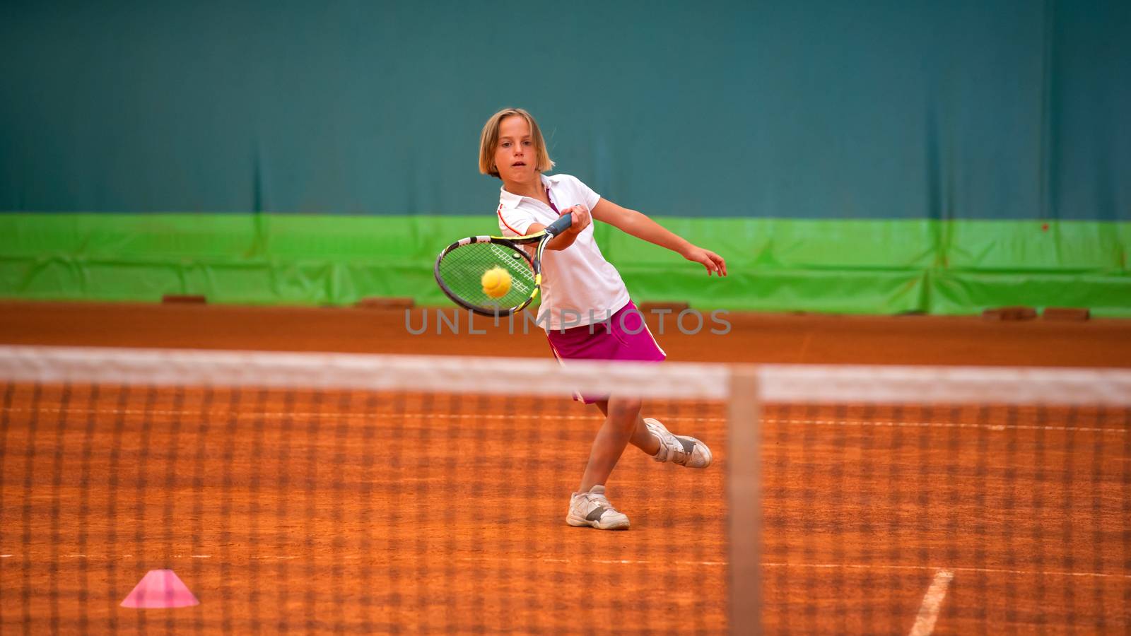 Children at school during a dribble of tennis