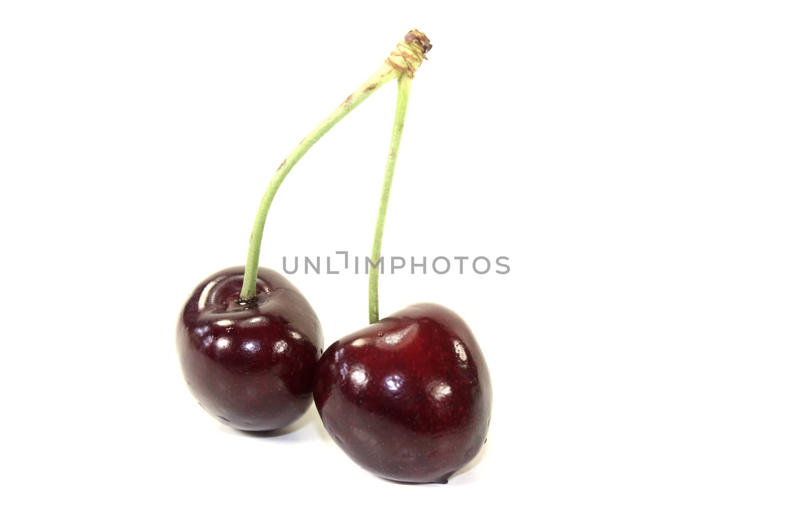 fresh red juicy cherries on a light background