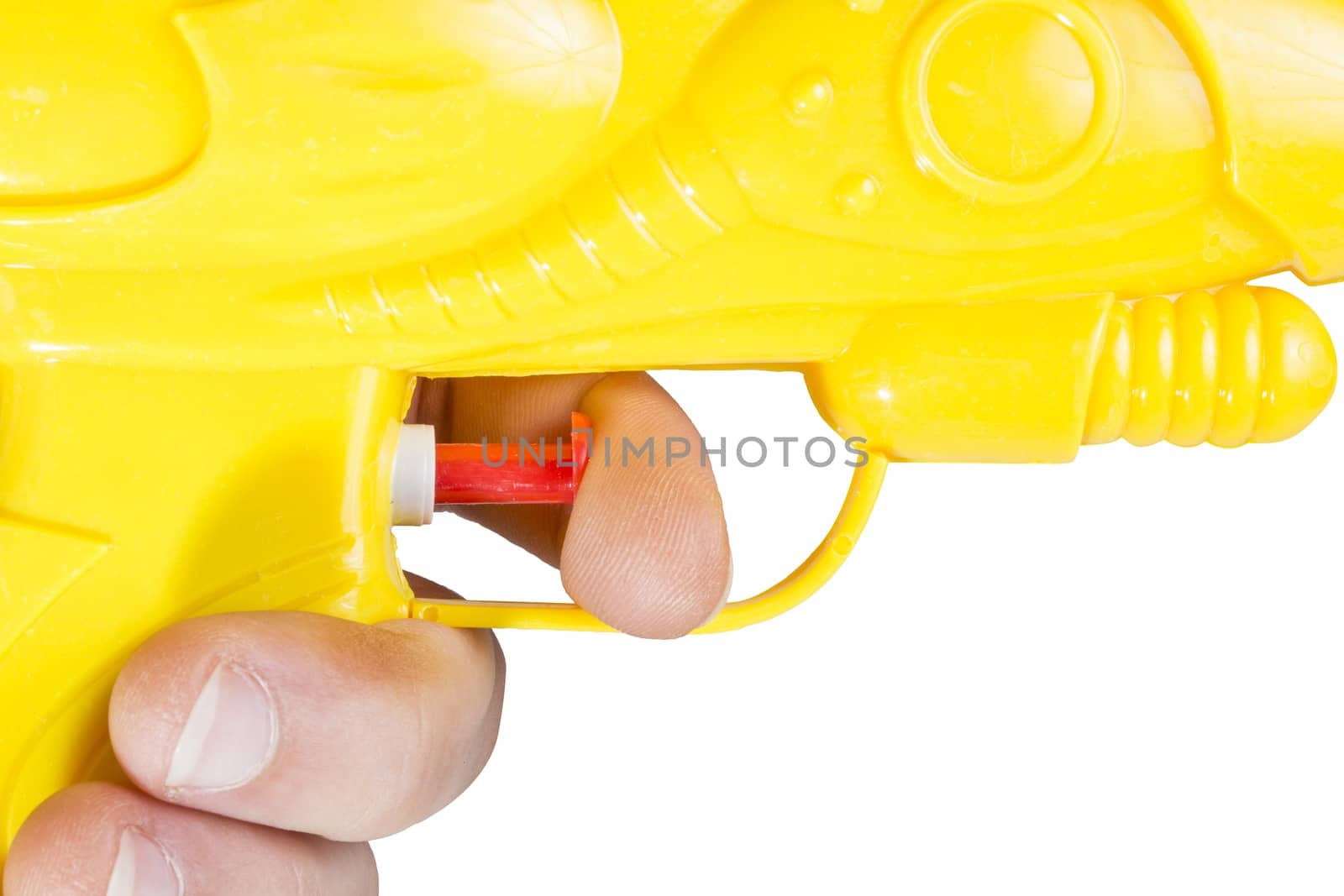 Close-up picture of a watergun with human hand