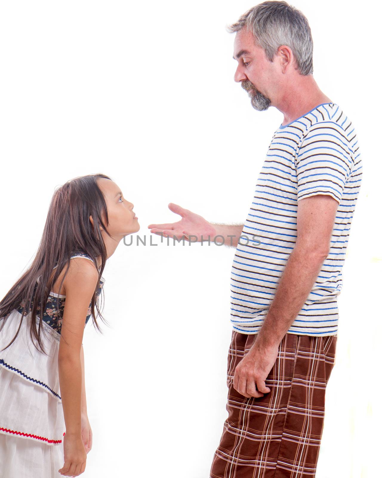 Father scolding naughty daughter. Pointing finger.