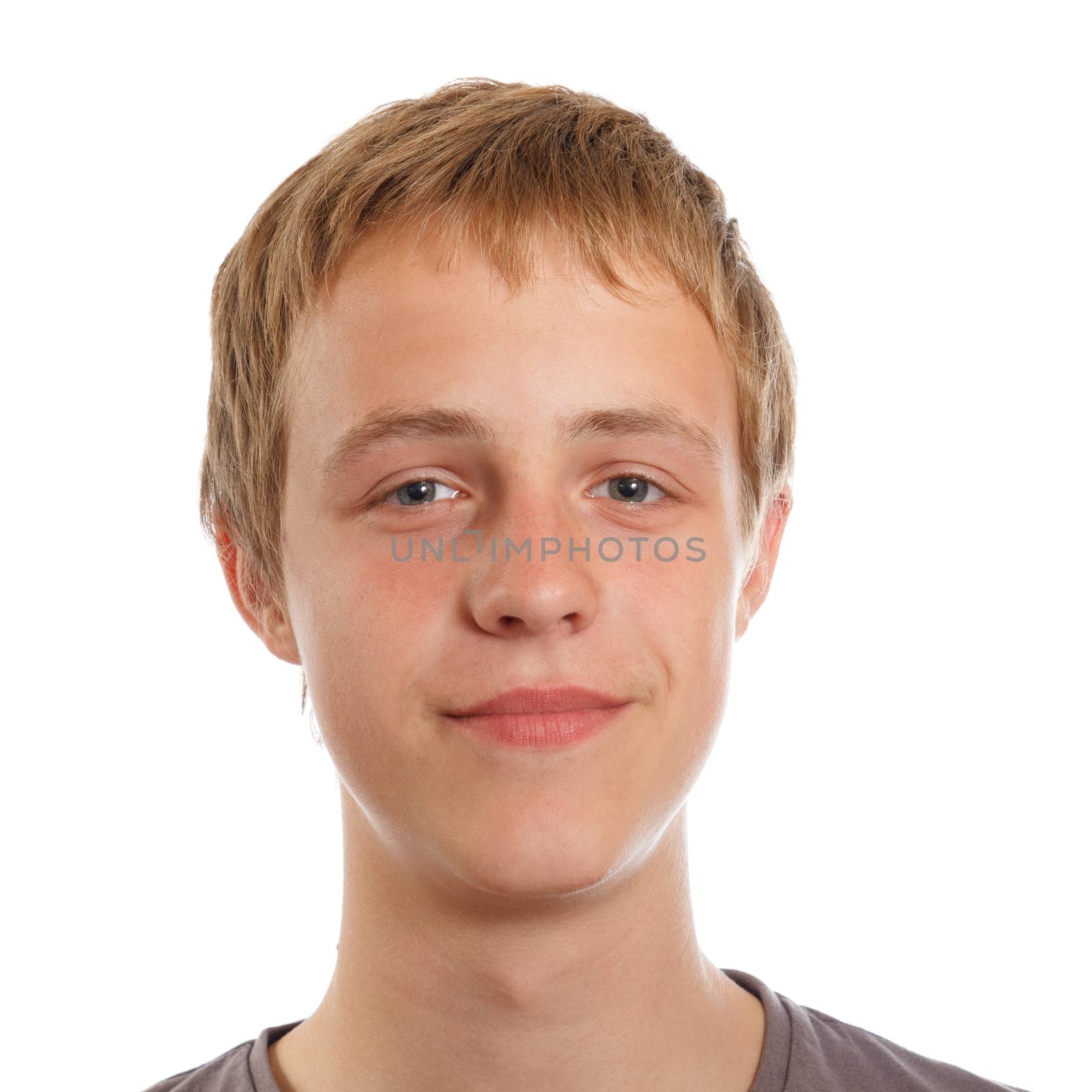 A smiling light brown haired male teenager