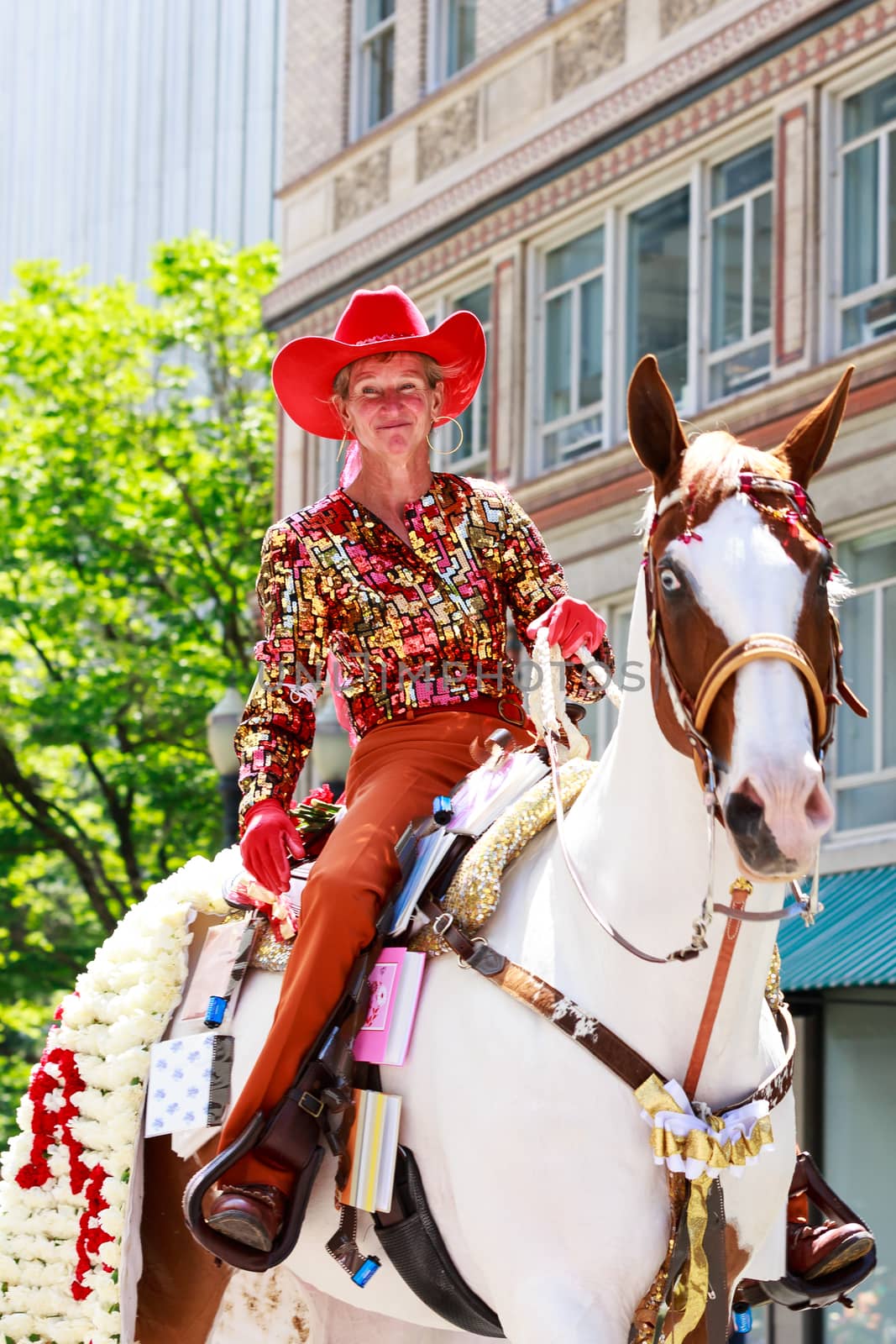 Portland, Oregon, USA - JUNE 7, 2014: Maggy Constantino in Grand floral parade through Portland downtown.