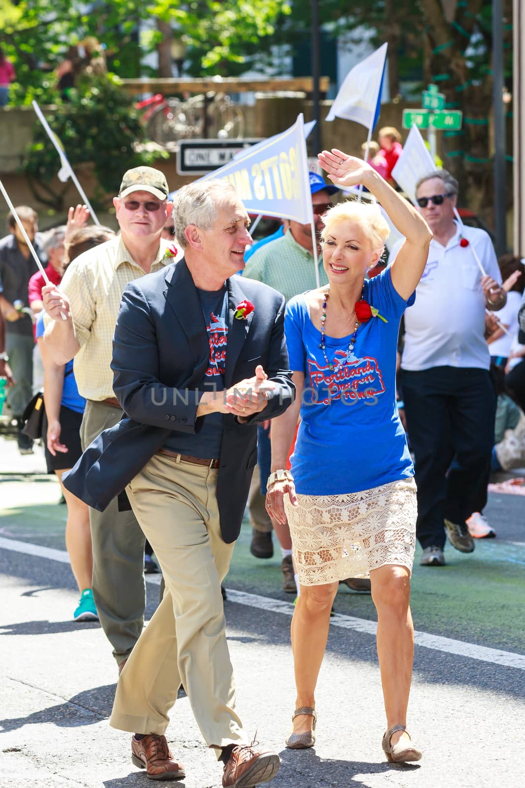 Portland, Oregon, USA - JUNE 7, 2014: Mayor Charlie Hales and wife in Grand floral parade through Portland downtown.