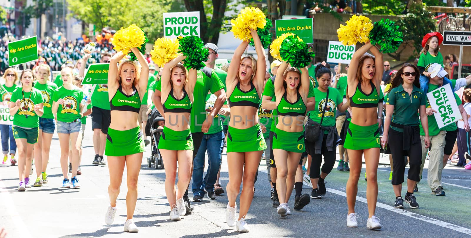 Portland, Oregon, USA - JUNE 7, 2014: University of Oregon Cheerleaders in Grand floral parade through Portland downtown.