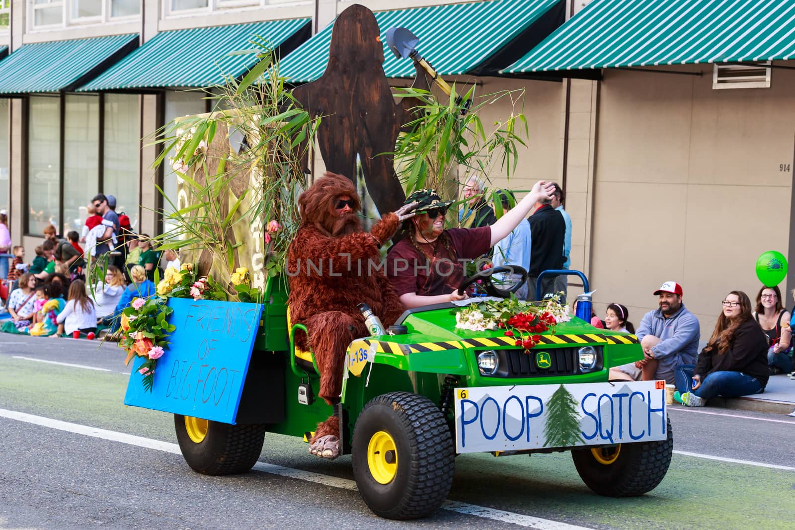 Portland, Oregon, USA - JUNE 7, 2014: Park Bureau Scooper in Grand floral parade through Portland downtown.