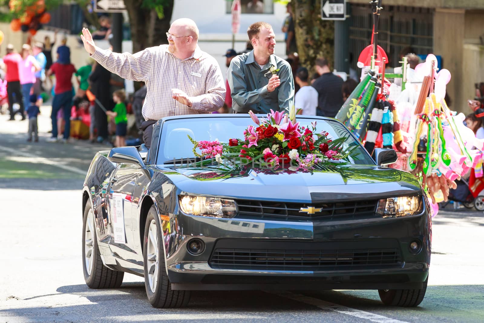 Portland, Oregon, USA - JUNE 7, 2014: Oregon Teacher of the Year, Brett Bigham in Grand floral parade through Portland downtown.