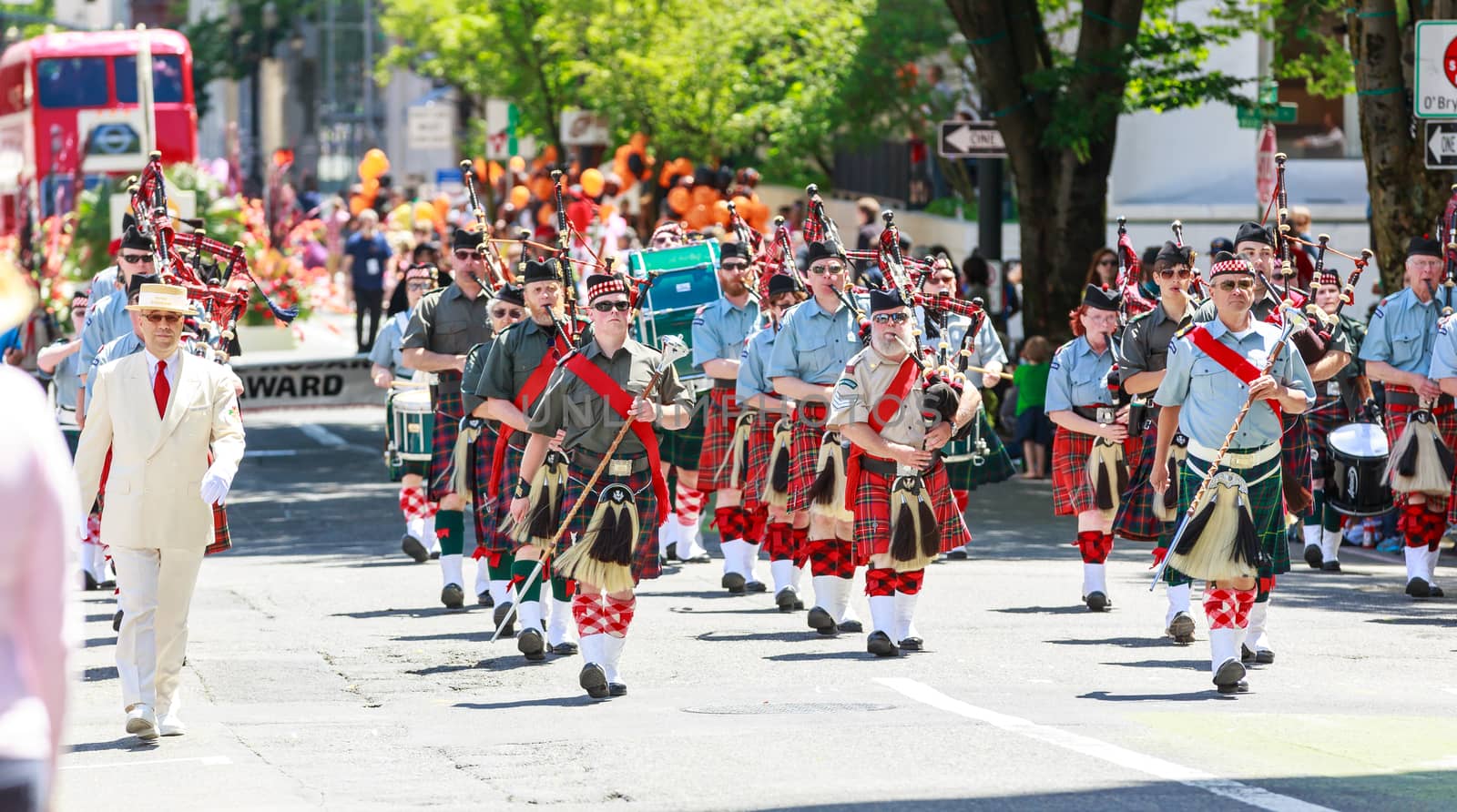 Portland, Oregon, USA - JUNE 7, 2014: Clan Macleay Pipe Band in Grand floral parade through Portland downtown.