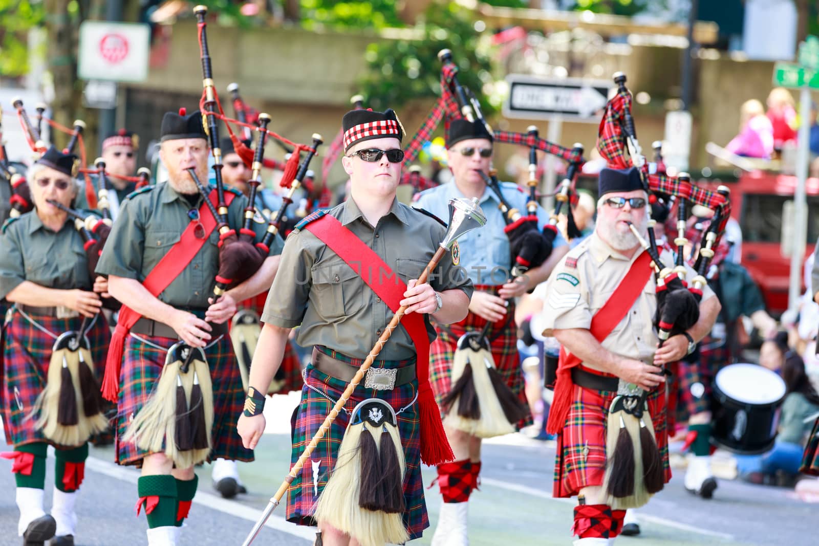 Portland, Oregon, USA - JUNE 7, 2014: Clan Macleay Pipe Band in Grand floral parade through Portland downtown.