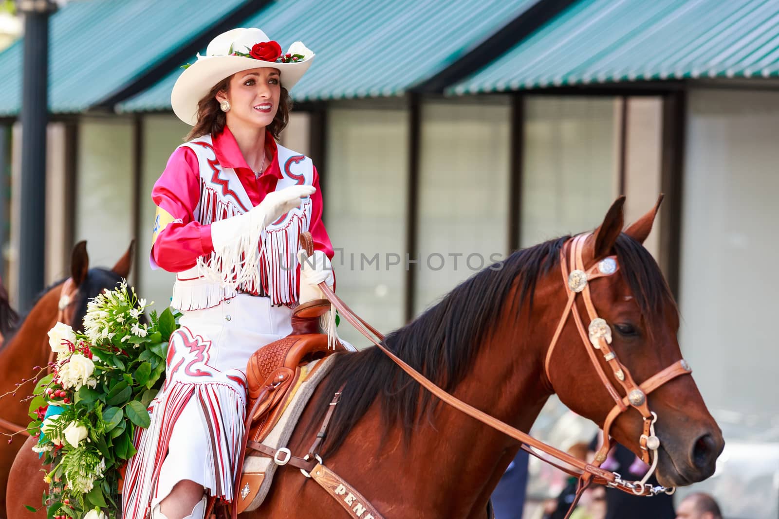 Portland, Oregon, USA - JUNE 7, 2014: Pendleton Round-Up Queen and Court in Grand floral parade through Portland downtown.