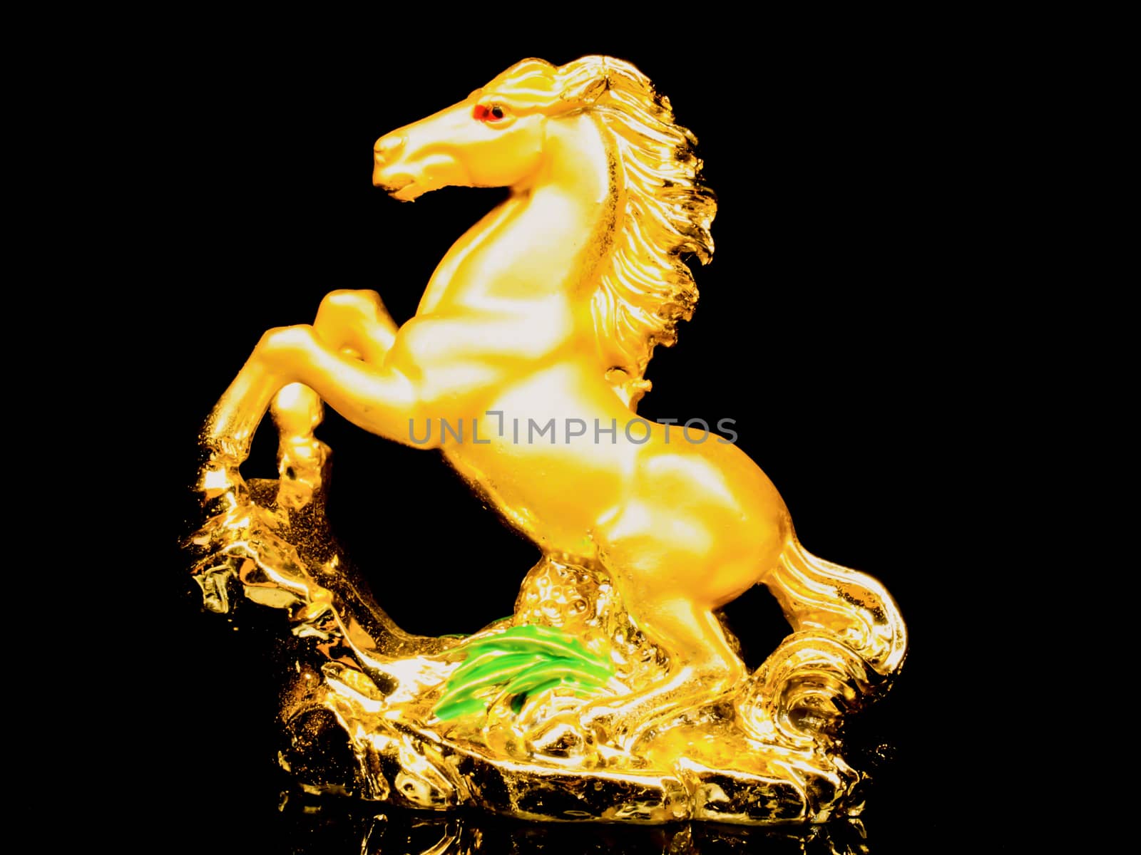 golden horse with black background