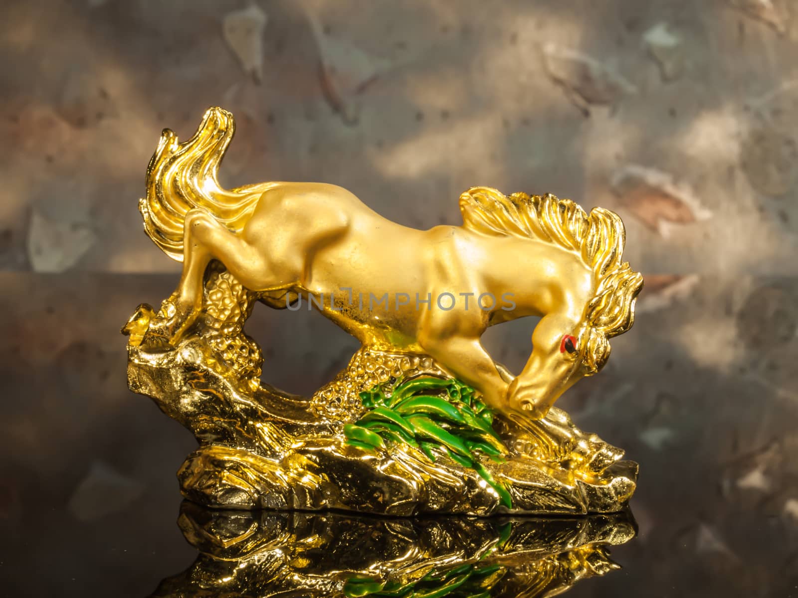 golden horse with wood background