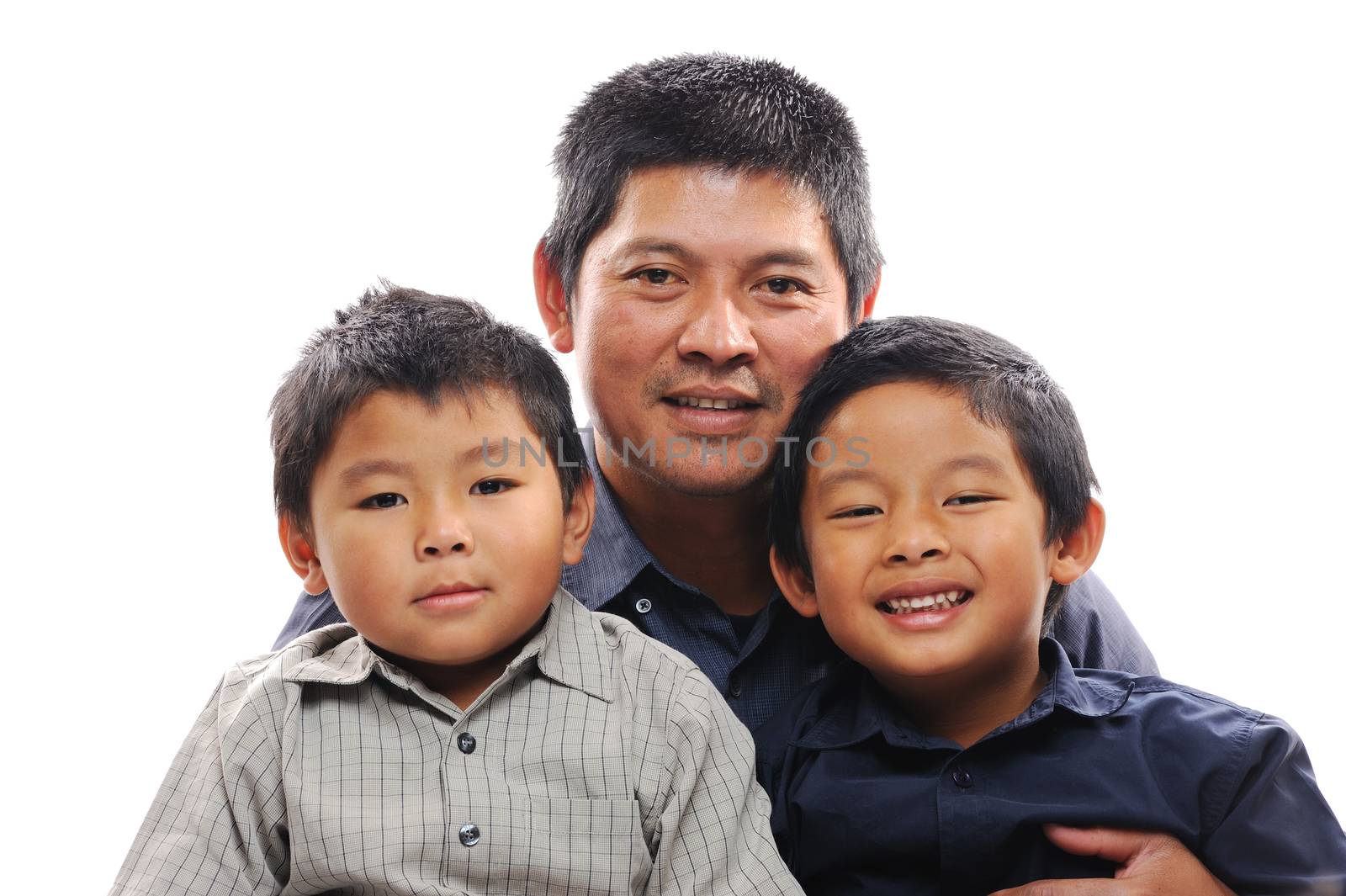 Asian father cuddles sons looking happy