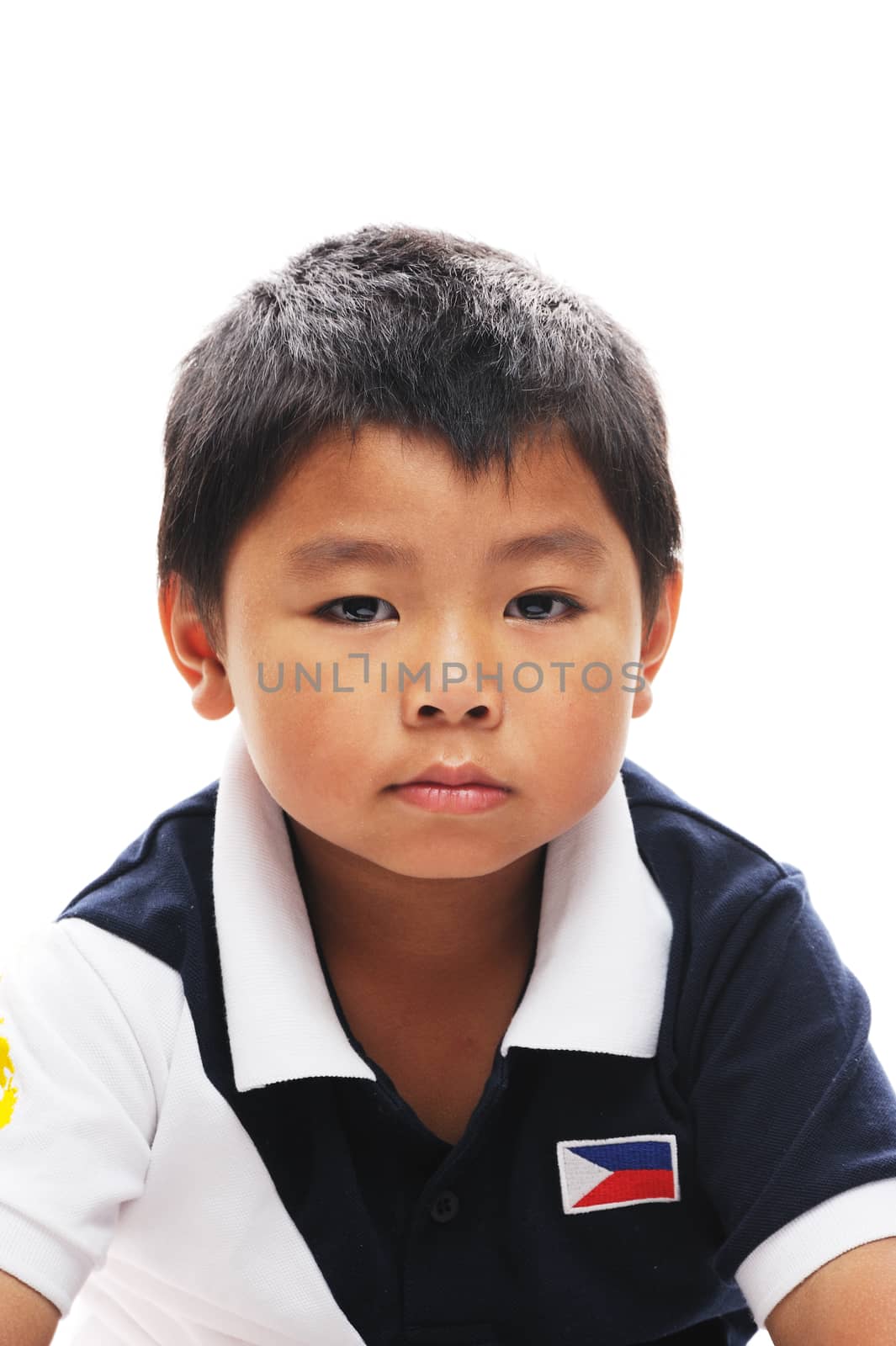 Asian boy from philippines looks grumpy