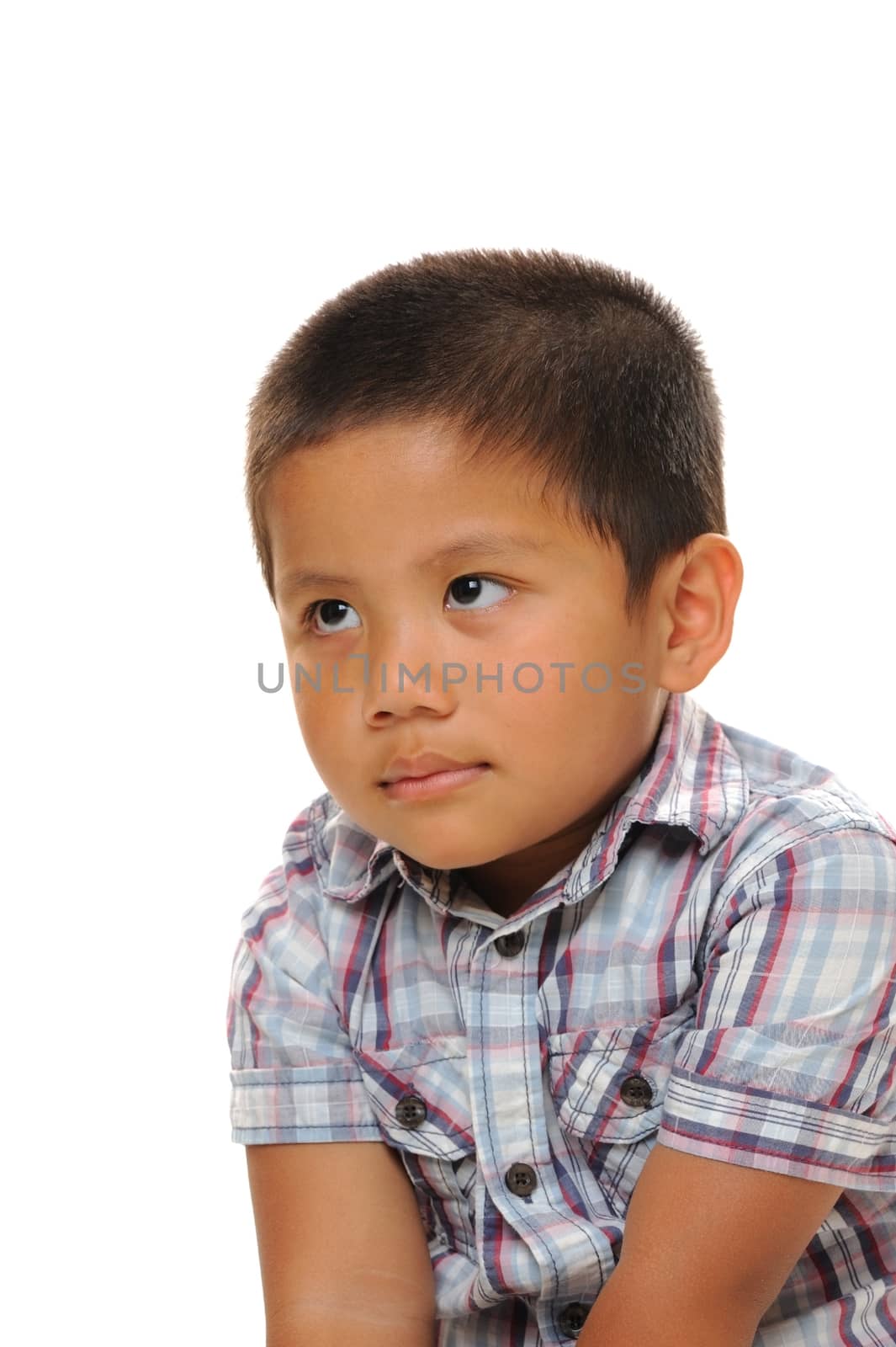 Asian boy wearing fashionable shirt staring into space