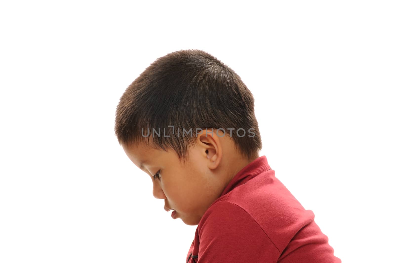 Asian boy looking sad profile view with red shirt