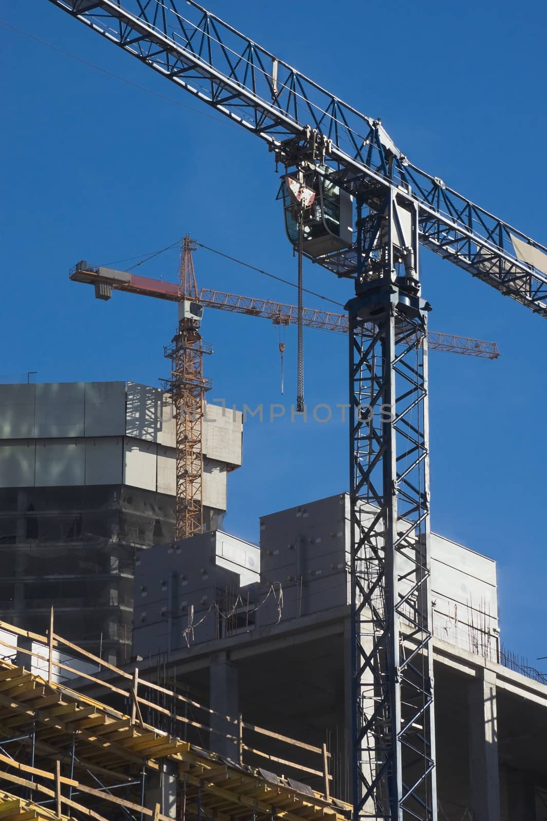 Elevating cranes on the construction site of Moscow business center