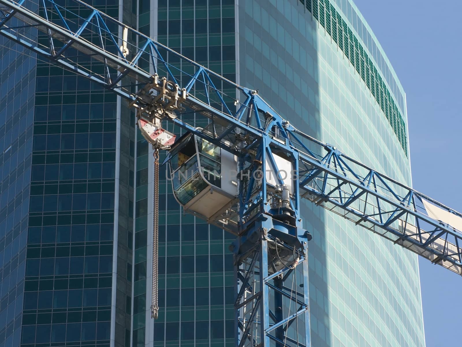 Cab of elevating crane on construction of the office building