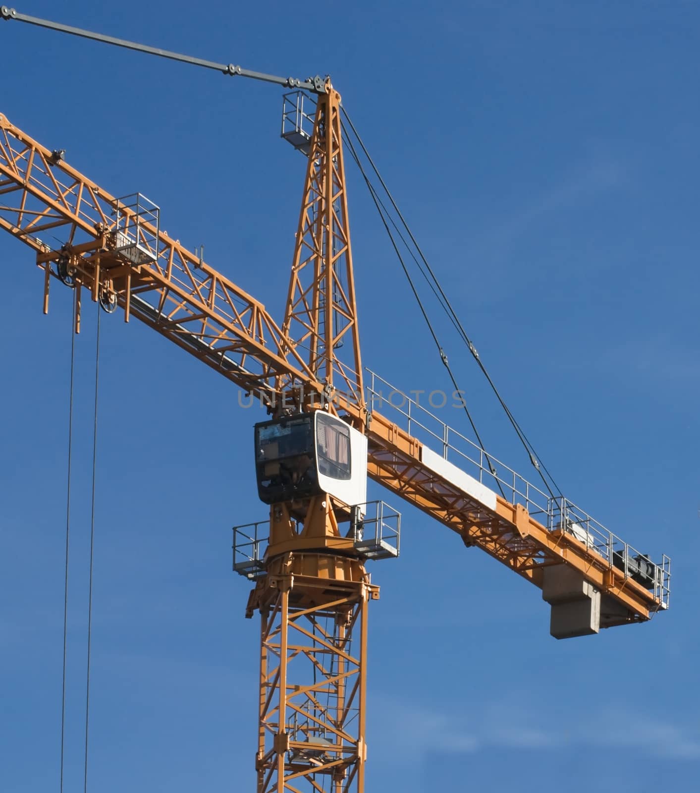 Cab of elevating crane on construction of the office building