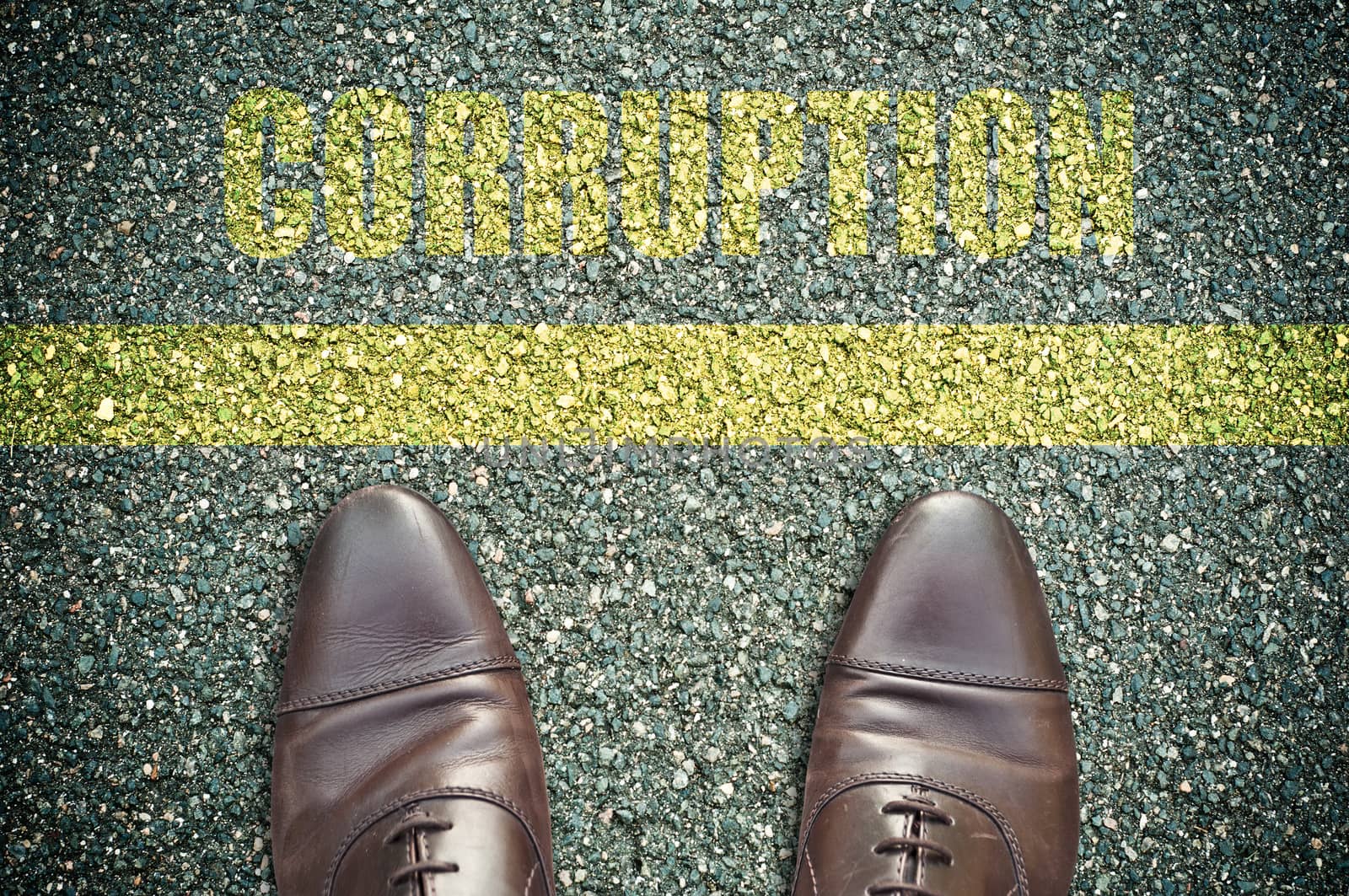 concept message on the road with feet - corruption