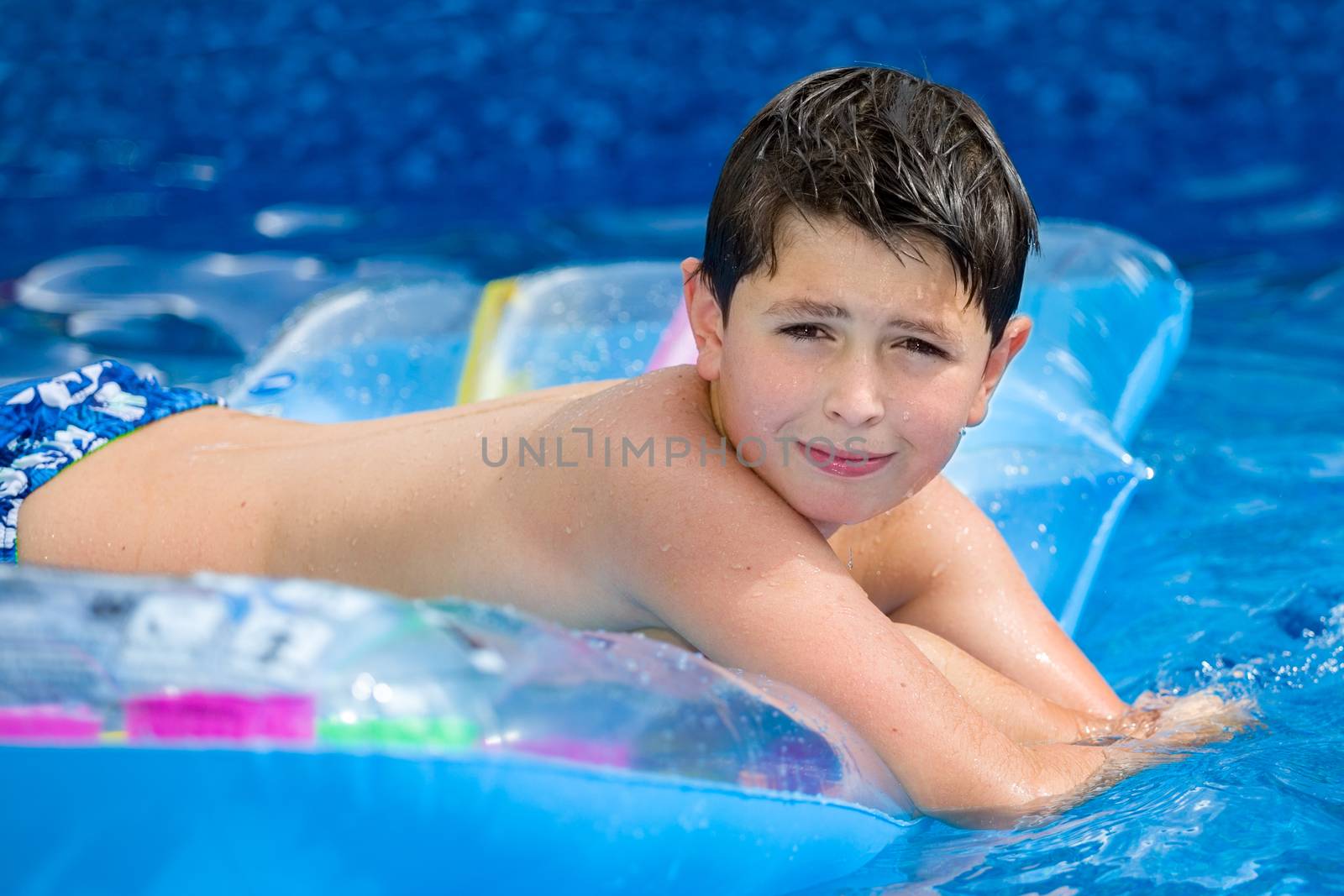 Boy in swimming pool  by artush