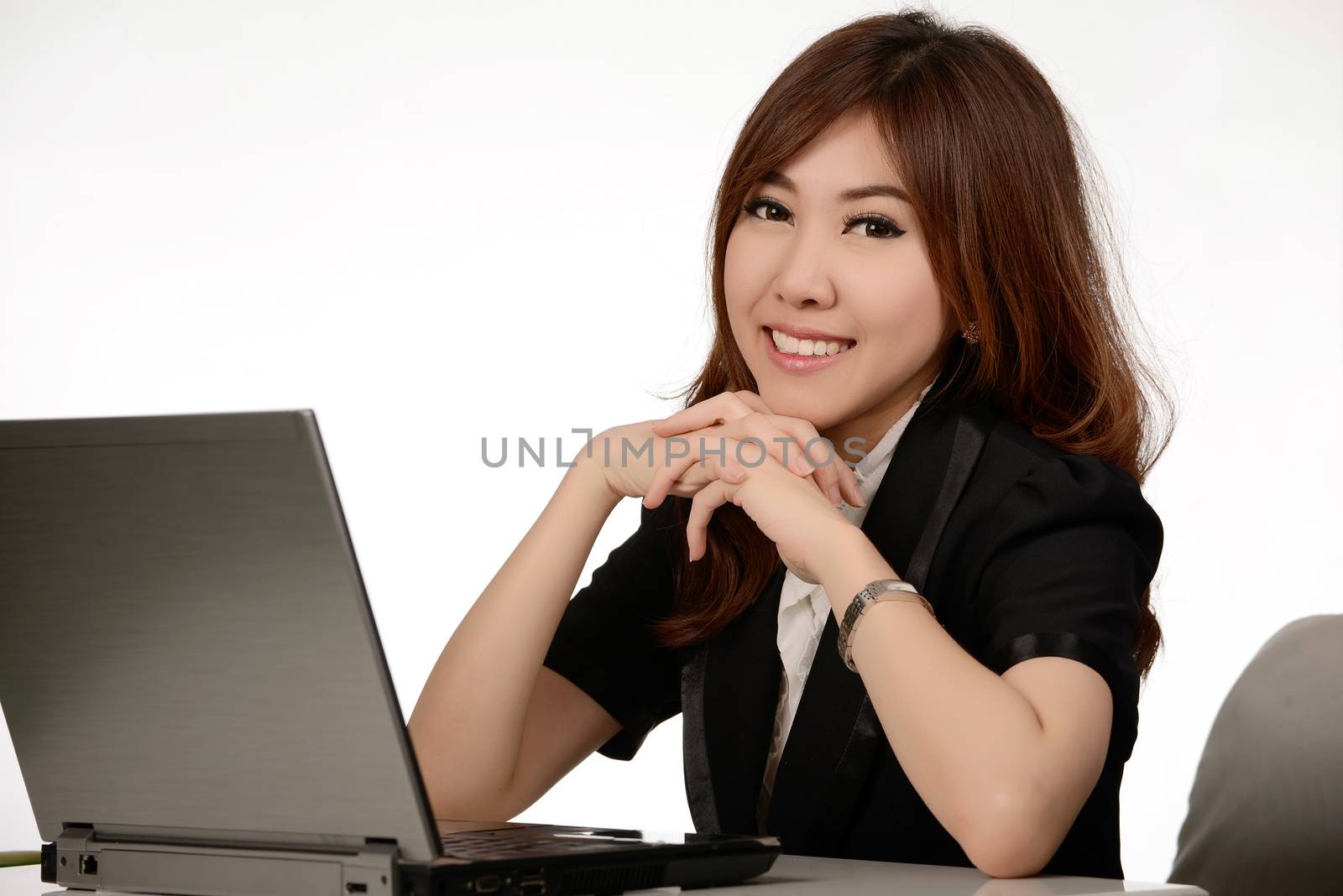 Young business woman working with Notebook at office by Yuri2012