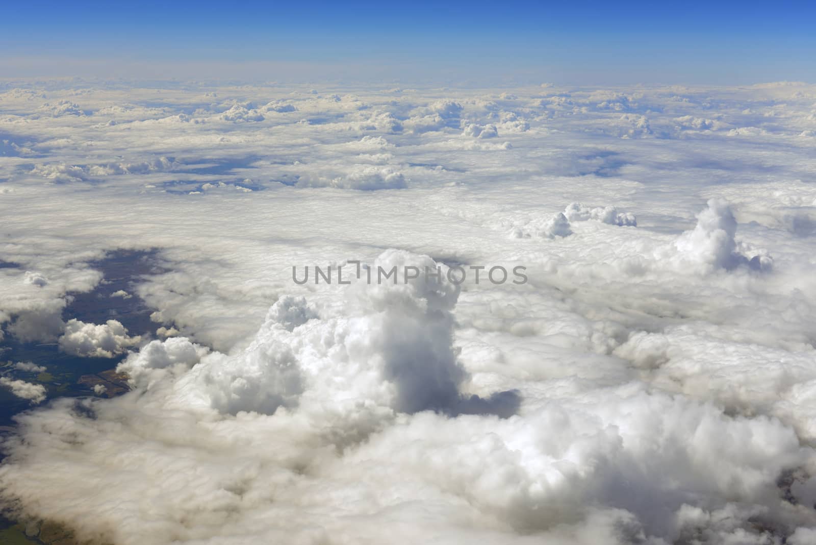 Blue sky and clouds. Top view of aircraft