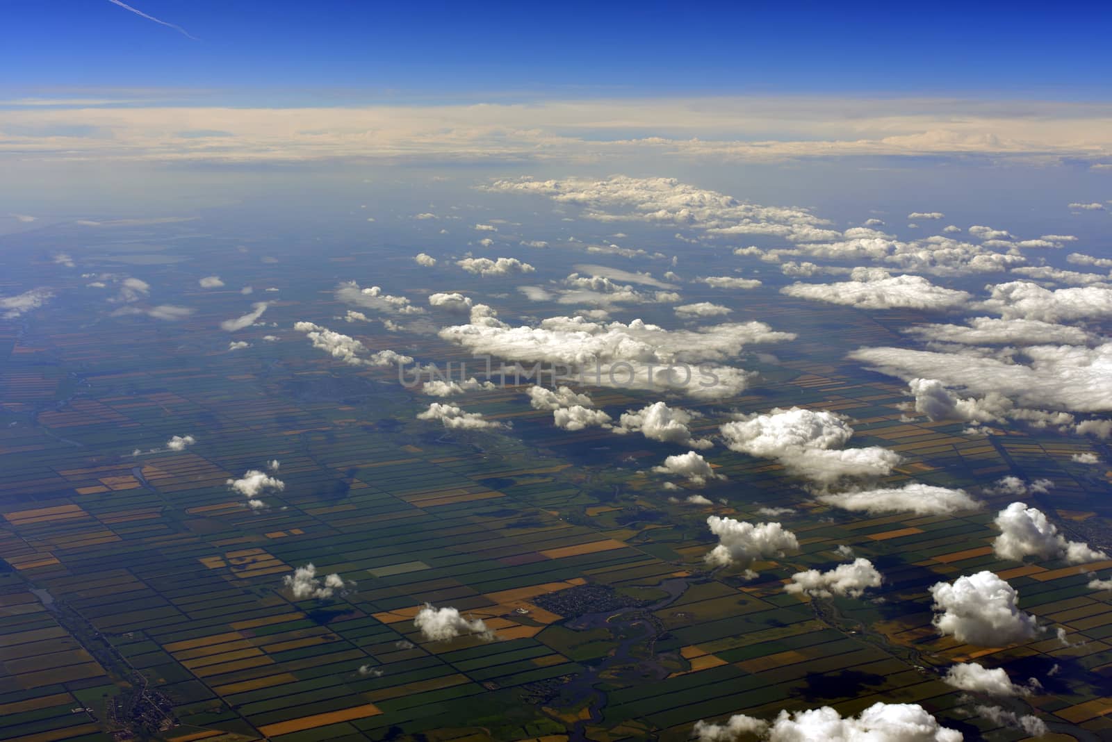 Earth's surface and clouds. Top view of aircraft