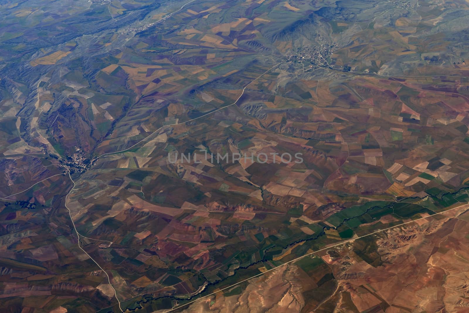 Earth's surface. Colorful fields. Top view of aircraft