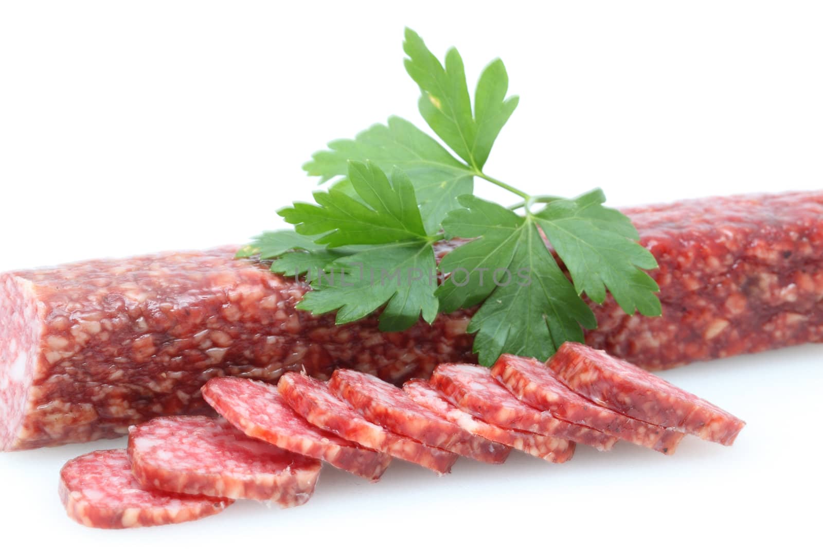 sausages and parsley on a white background