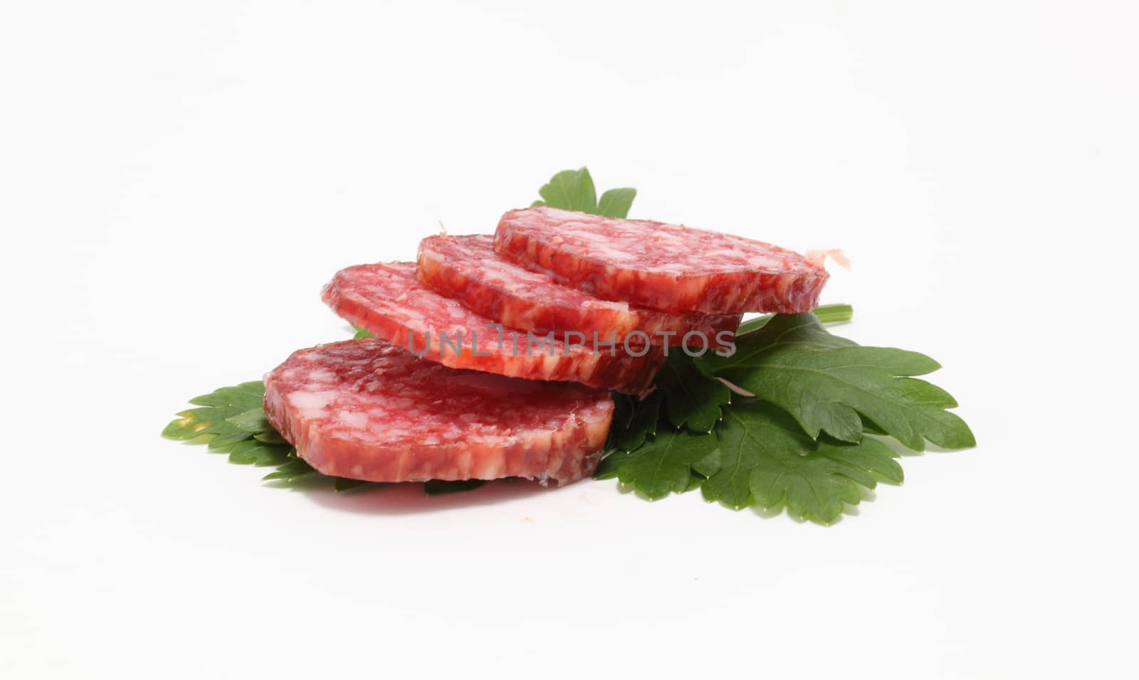 sausages and parsley on a white background