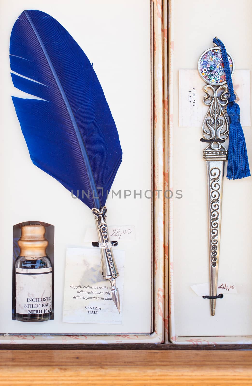 Close up of old feather pen with ink well