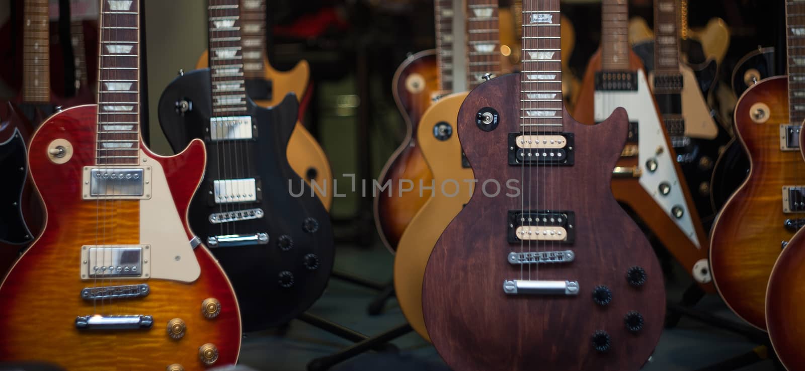 View of many guitars in the shop
