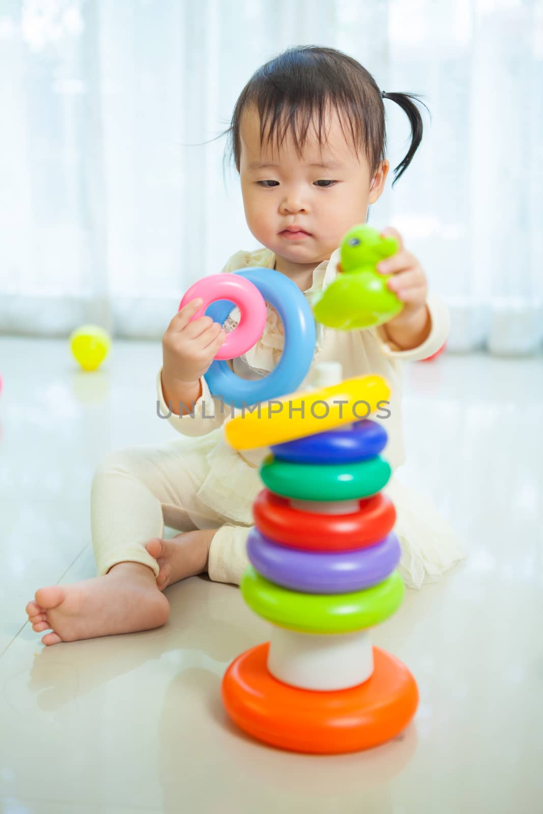 Portrait of little asian girl in home