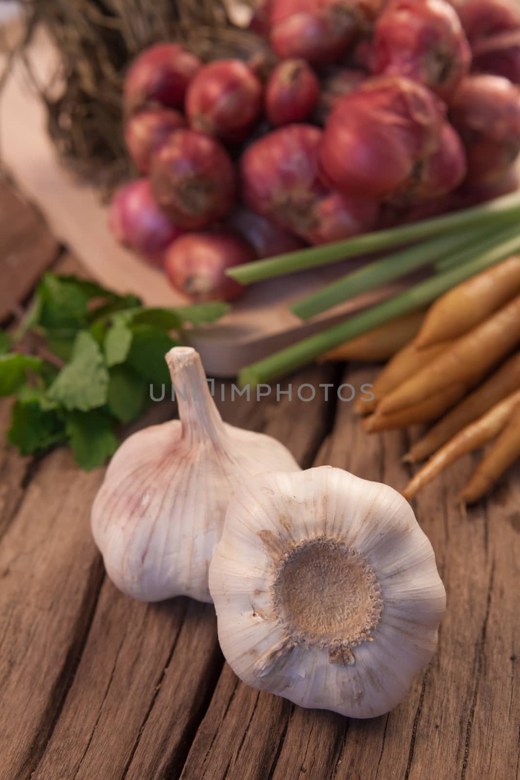 Organic garlic on the old wood background