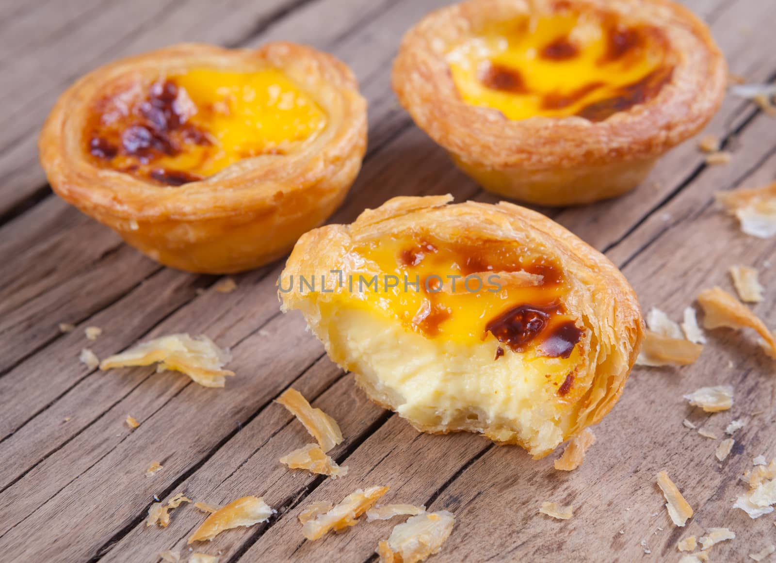 delicious portuguese egg tart on wood background