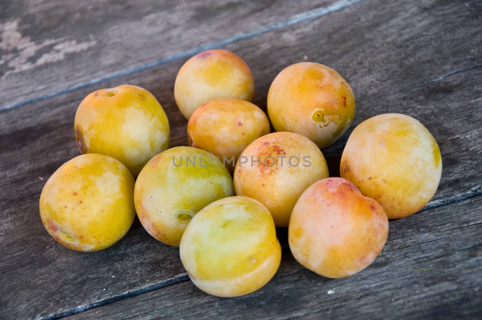 group of prunes on the wooden background