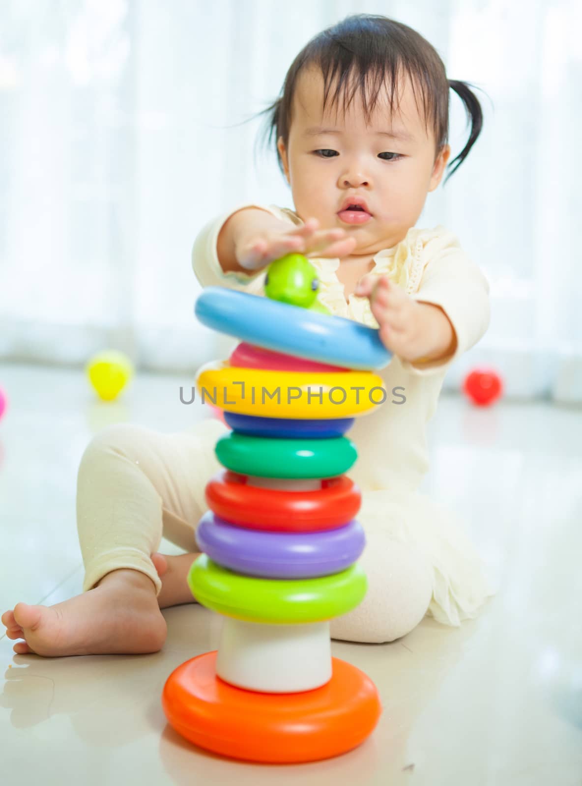 Portrait of little asian girl in home