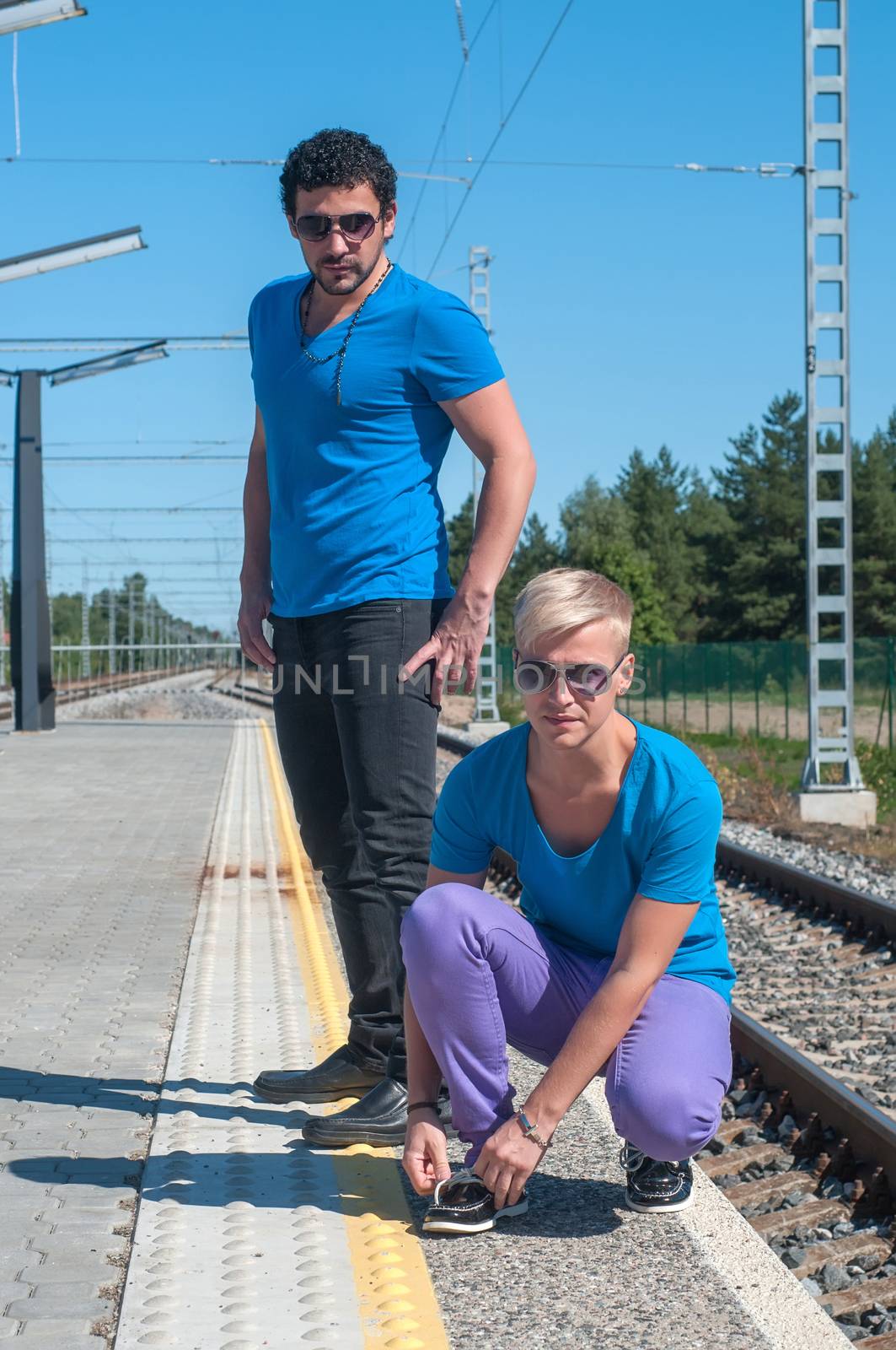 Handsome guys on train station by anytka