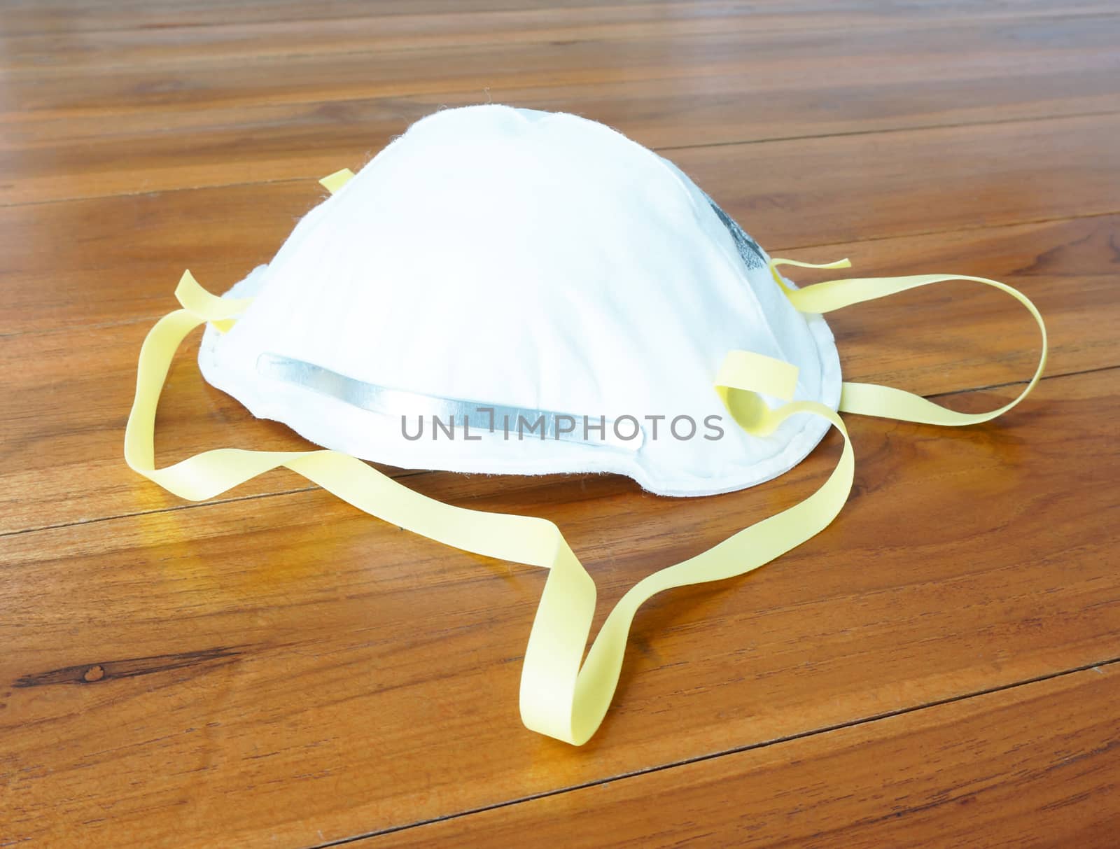 N95 mask on table by ninun