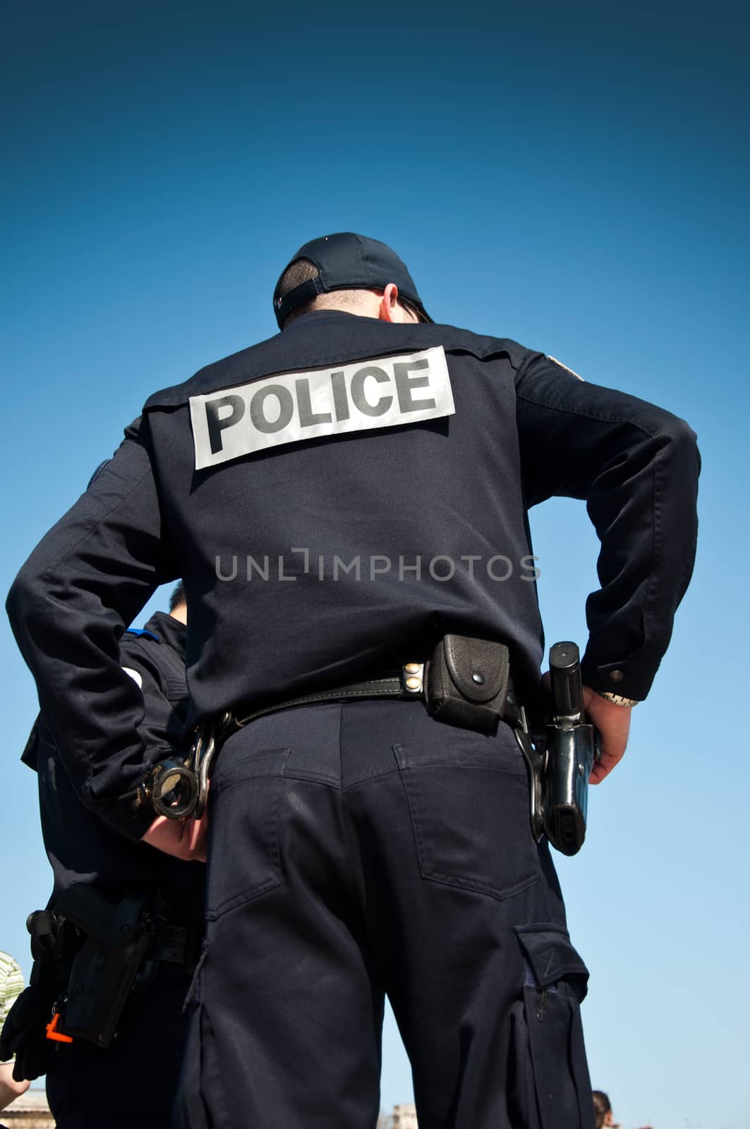 french policeman back with sky blue background